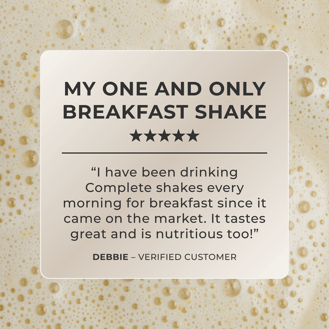A square promotional graphic with a cream-colored card centered over a foamy beige background. The card reads: “MY ONE AND ONLY BREAKFAST SHAKE,” with five stars, a customer quote about Complete shakes, and the name Debbie labeled as a verified customer.